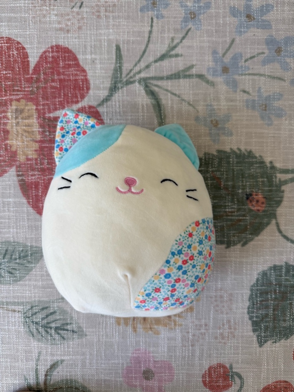 Small Squishmallow Plush Cat Pillow - Cream & Light Blue with Floral Accents